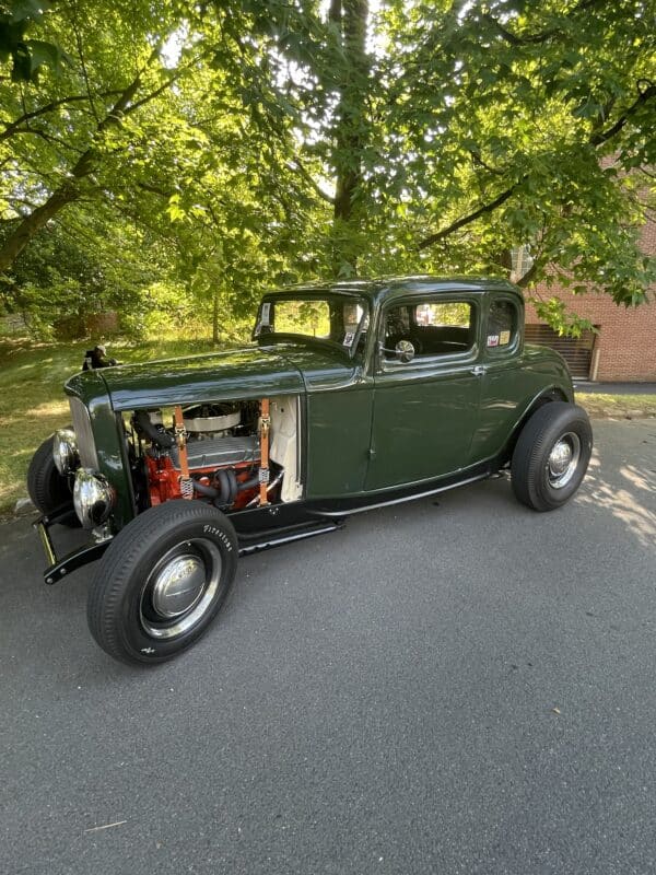 a vintage car at cars and coffee 