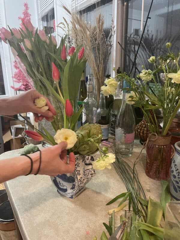 florist lisa waters arranges flowers in her vienna studio