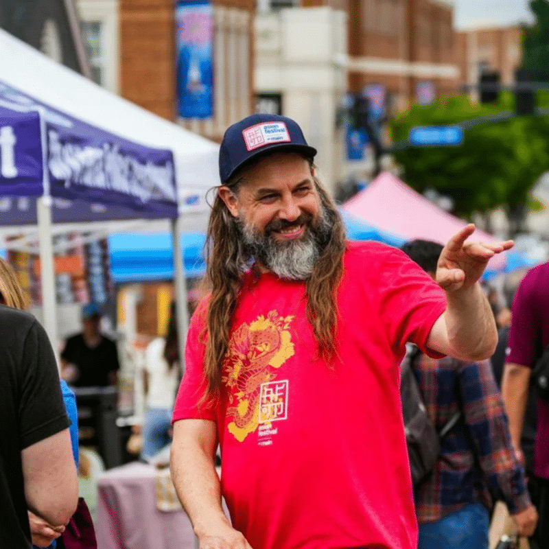 Josh greets attendees of the Asian Festival on Main 